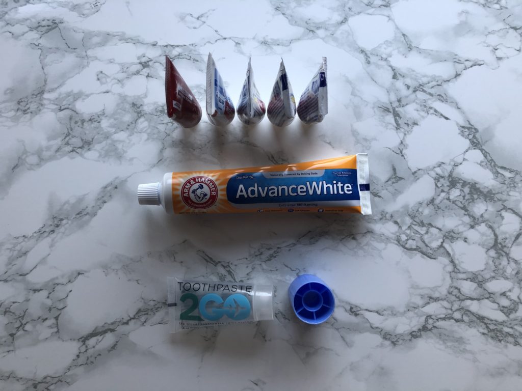 A row of toothpaste tubes representing the No Buy Use Up Challenge.